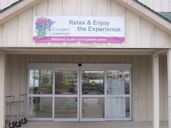 This banner welcomes customers to their local garden center.