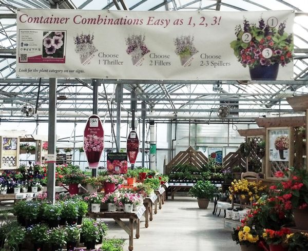 This 8' x 2' custom banner helps sell plants for container combinations and ties directly to their plant bench cards. Relevant plants are identified as either a 'Thriller', 'Spiller', or 'Filler' on the bench card.