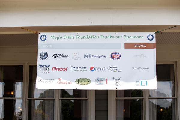 Silver and Bronze Level Sponsors are featured on a single vinyl banner.